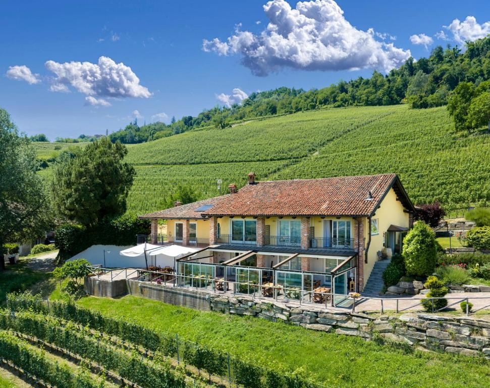 an aerial view of a house in a vineyard at Eremo della Gasprina in La Morra