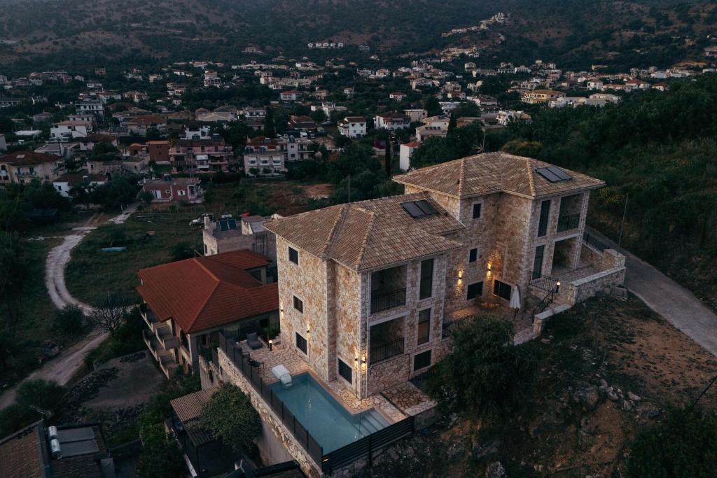 an aerial view of a house with a view of a city at Lambda Luxury Villa 2 in Syvota