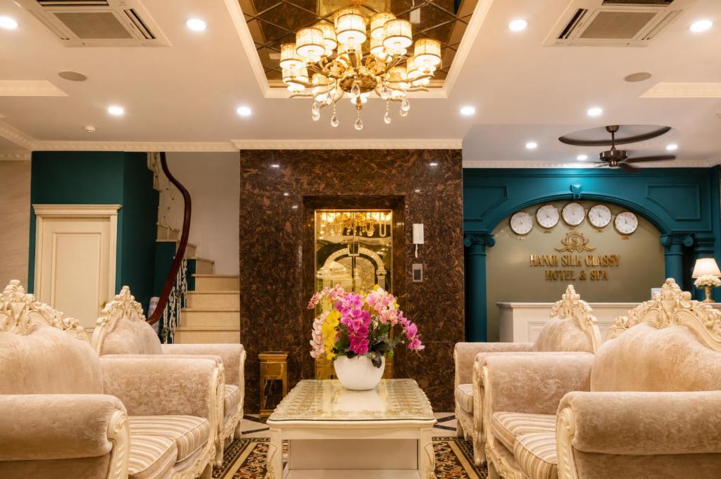 a room with a set up for a wedding with chairs and flowers at Hanoi Silk Classy Hotel & Travel in Hanoi