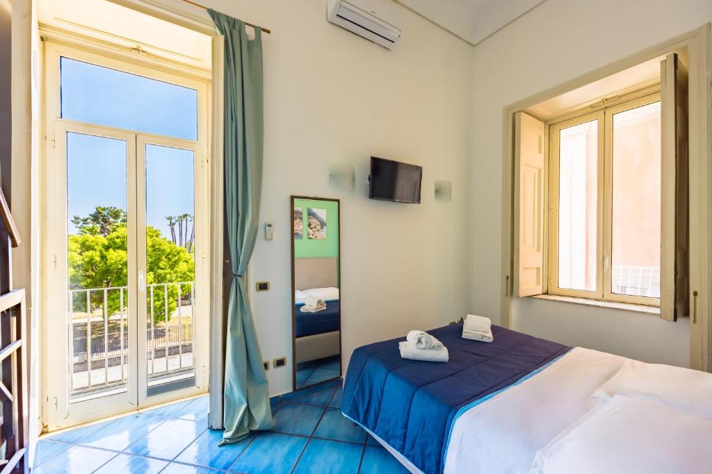 a bedroom with a bed and a large window at Waterfront Riviera in Naples