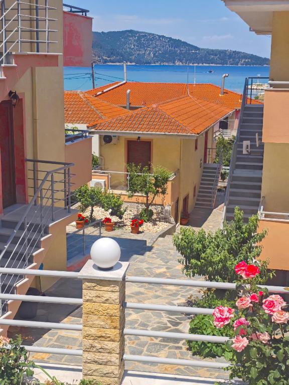 a view of a street with buildings and flowers at Lavender Apartments in Skala Potamias