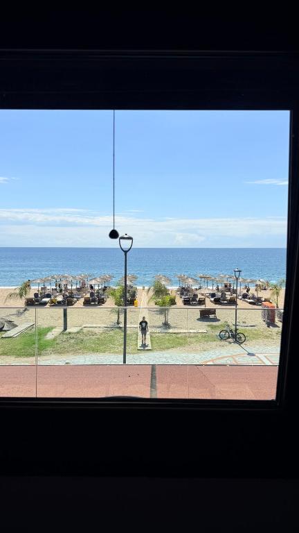 a view of the ocean from a window at Sabbia Suites in Nea Vrasna