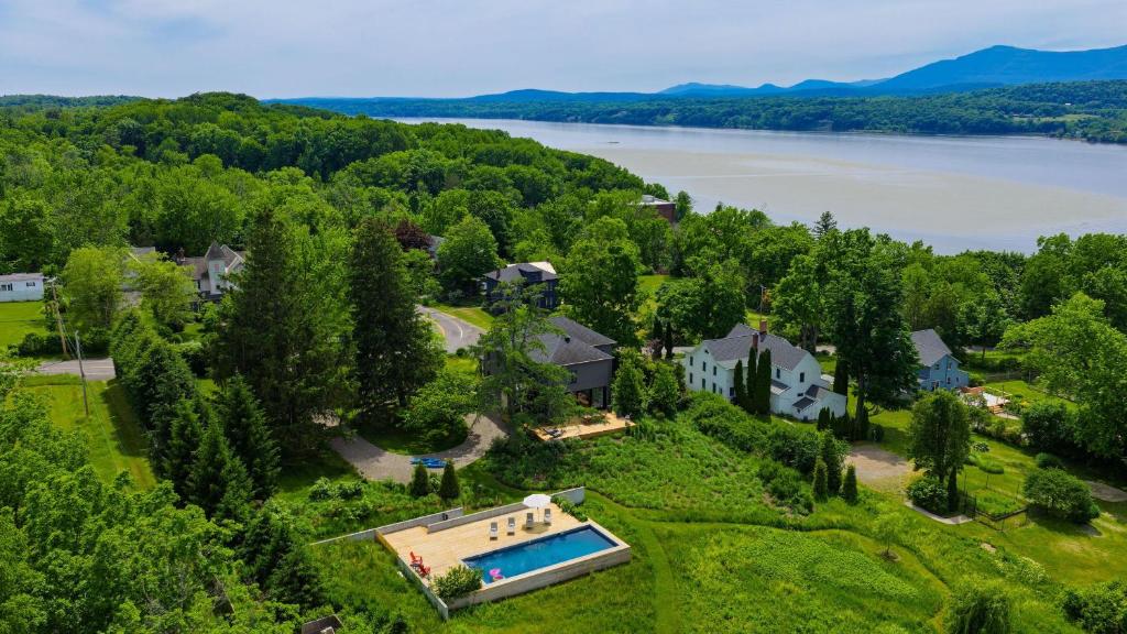 an aerial view of a large house with a swimming pool at River View by AvantStay in Germantown