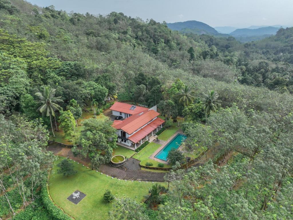 an aerial view of a house with a swimming pool at Leaf Watagala in Avissawella
