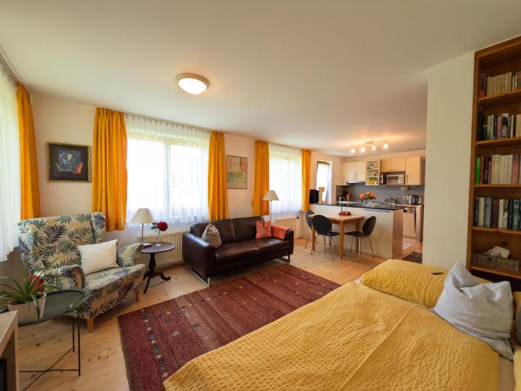 a living room with a bed and a couch at Apartment Denk in Bregenz
