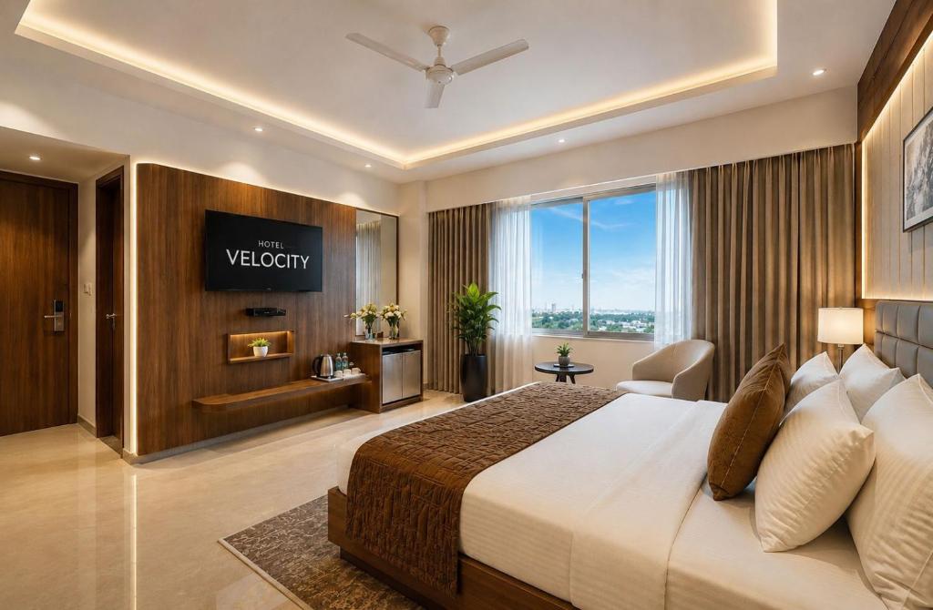 a hotel room with a bed and a large window at Hotel Velocity Near Terminal 3 Delhi International Airport With- Free Pickup in New Delhi