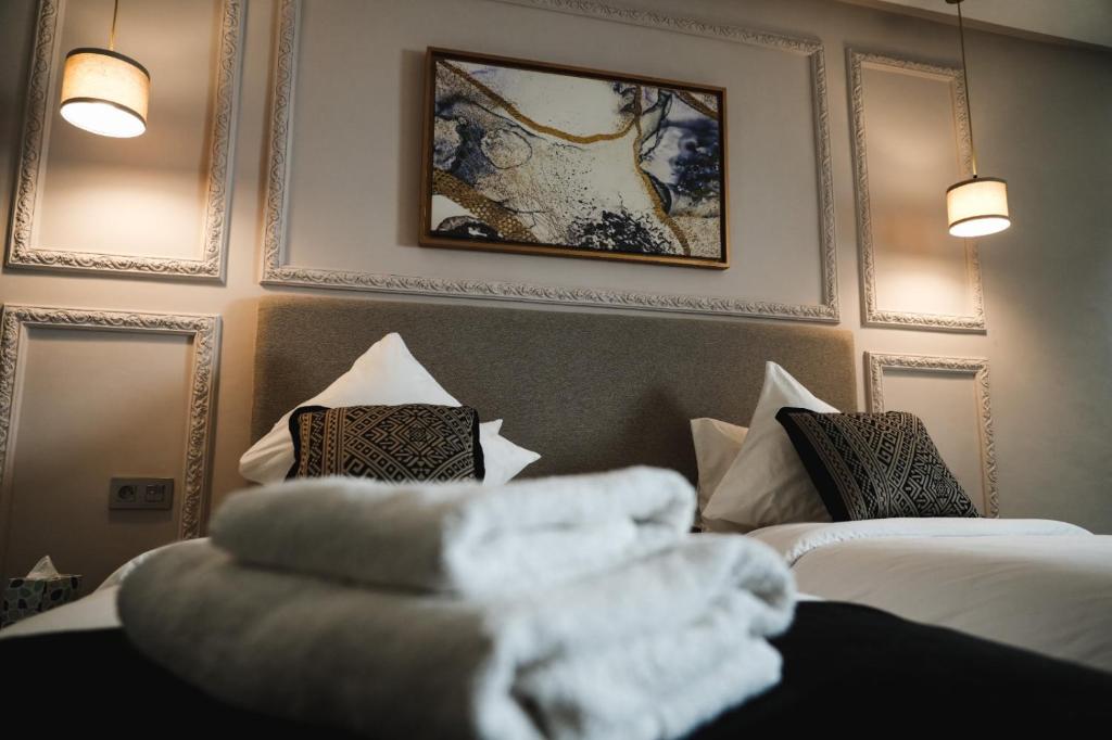 a hotel room with two beds with towels on them at Dakhla Boarding Hotel & Restaurant in Dakhla