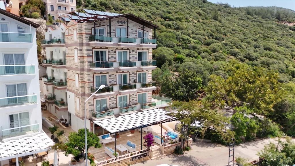an aerial view of a building with a mountain at Kas Maki Hotel in Kaş