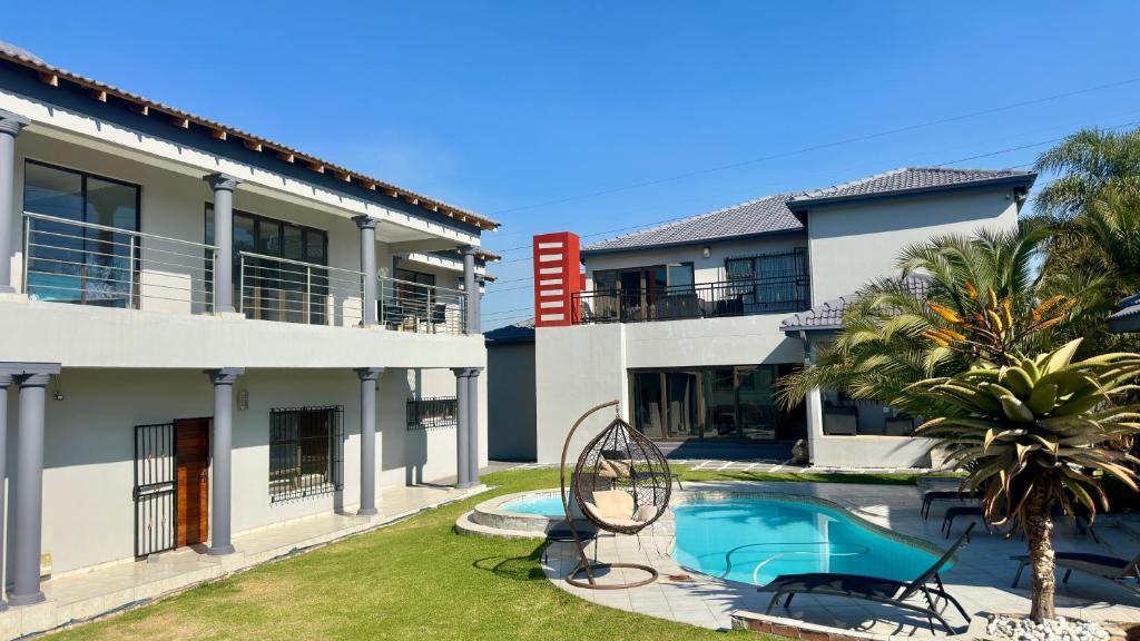 a view of a house with a swimming pool at Nyasa Villa in Southgate