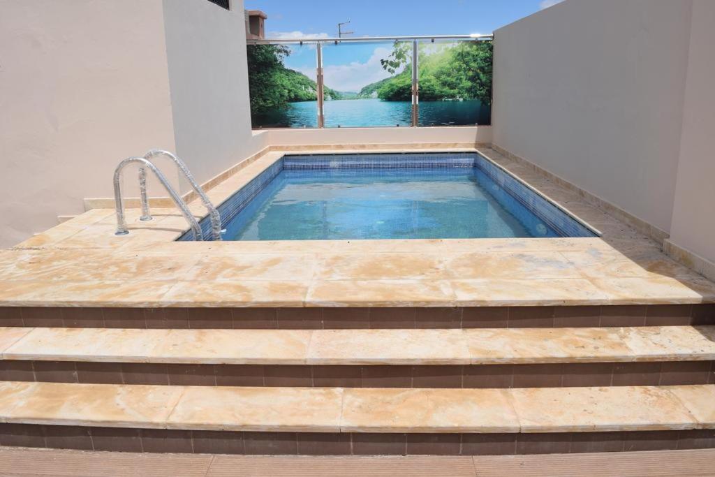 a plunge pool with a view of the water at Hôtel Teranga & Spa in Marrakesh