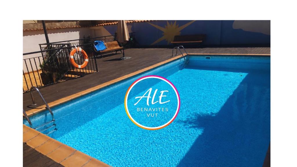 a swimming pool with a sign on the side of it at Ale Benavites in Ávila