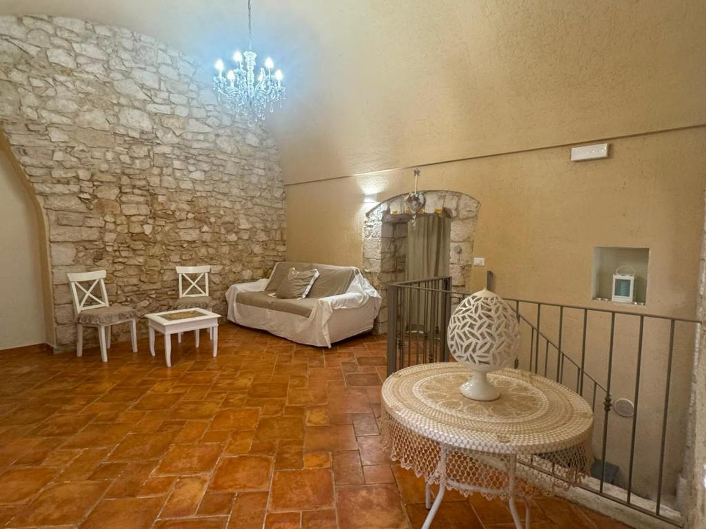 a living room with a couch and a table at MaryClouBert-Home in Molfetta