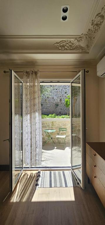 a room with a sliding glass door to a patio at Huma Living in Vlorë