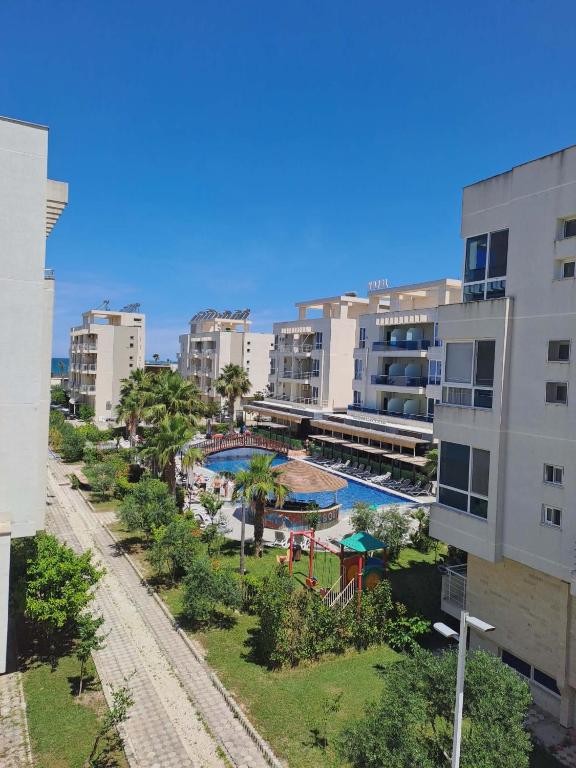 an aerial view of a resort with a pool and buildings at Mimosa Apartment in Vlorë