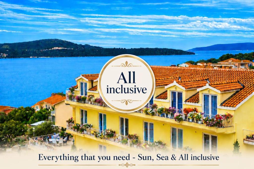 an all inclusive hotel with a view of the water at All inclusive Villa Four Pearls in Trogir