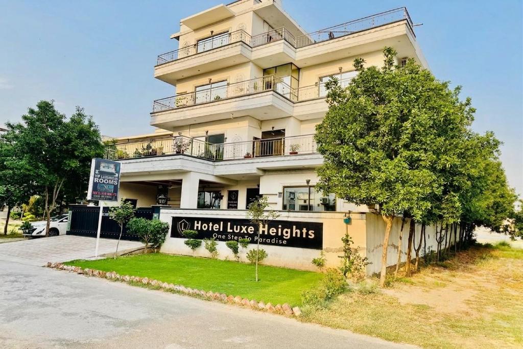 a building with a sign that reads hotel love heights at Hotel Luxe Heights Lahore in Lahore