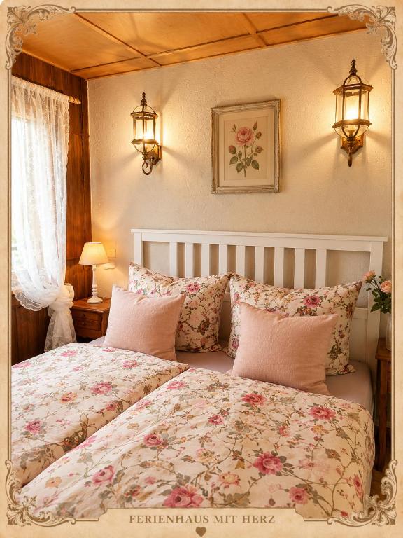 a bedroom with a bed with a floral bedspread at Emma's Vintage Ferienhaus mit Kamin in Friedrichsbrunn