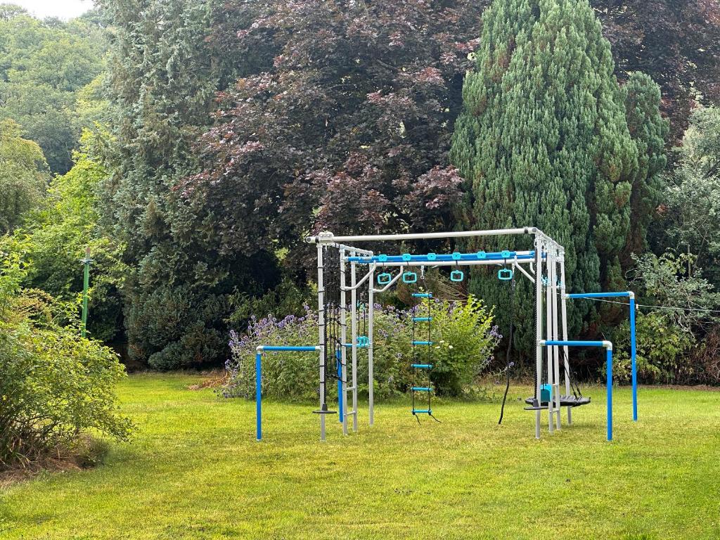 an empty playground in a yard with trees at Duvale Priory - 9985 in Bampton