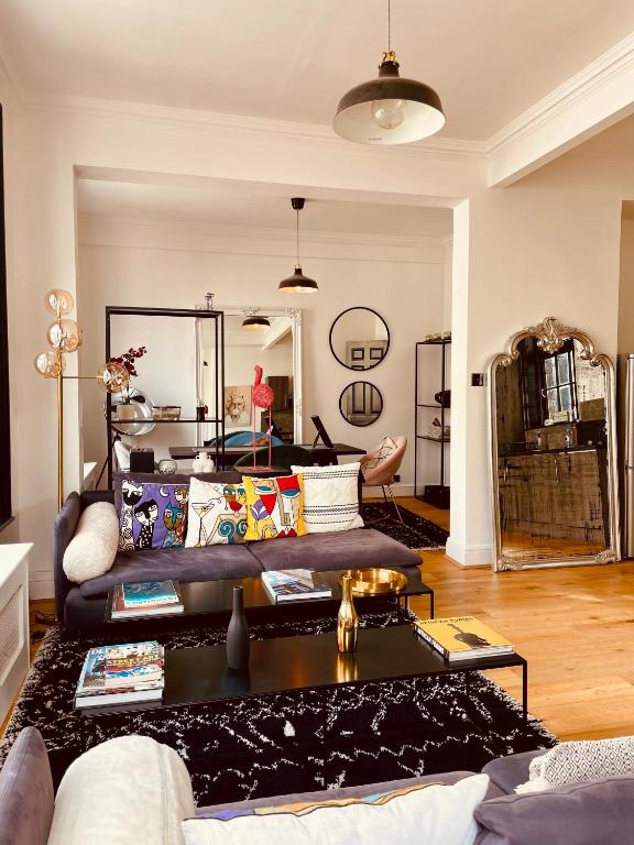 a living room with a couch and a table at ROBERT HOUSE in London