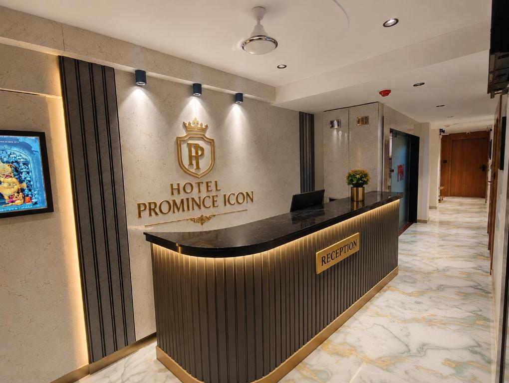 a hotel entrance with a hotel promise room sign on the wall at Hotel Promince Icon in Ahmedabad