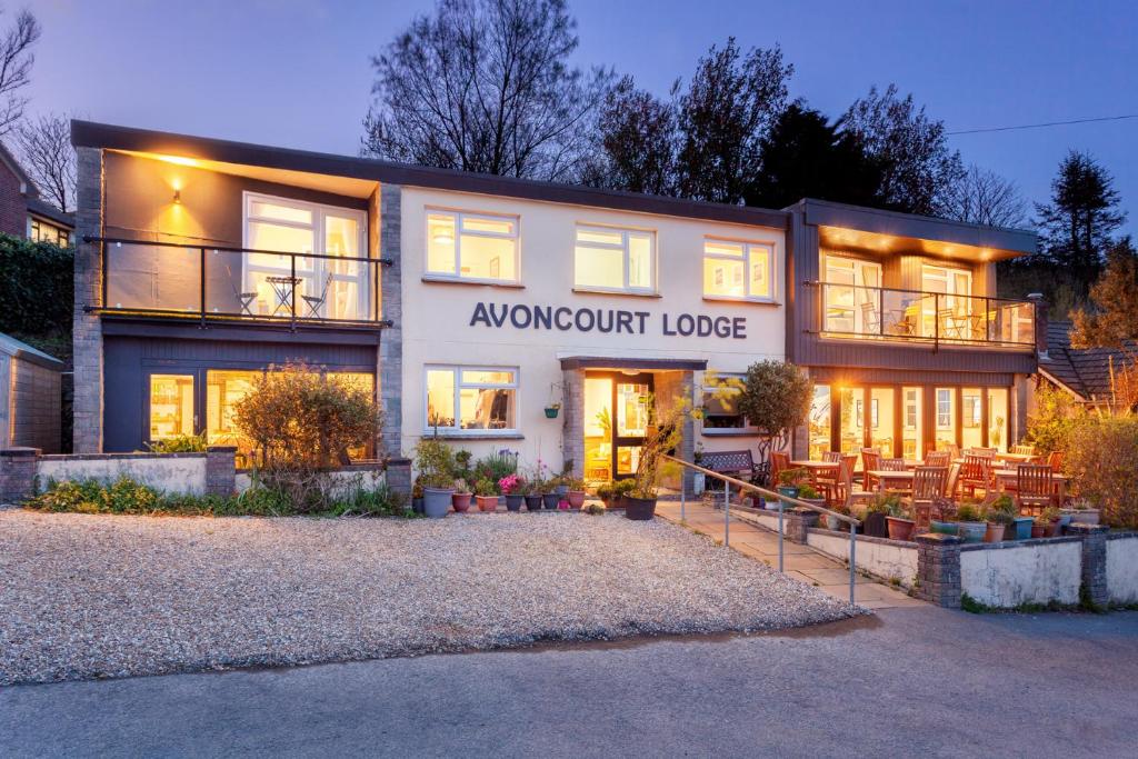 a house with a front entrance to a awoint lodge at Avoncourt Lodge in Ilfracombe