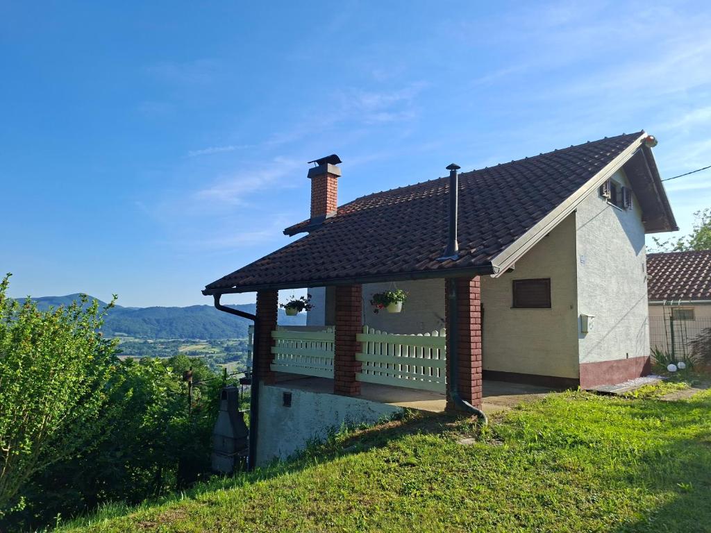 a house with a porch with a fence at Milla Sky in Varaždinske Toplice