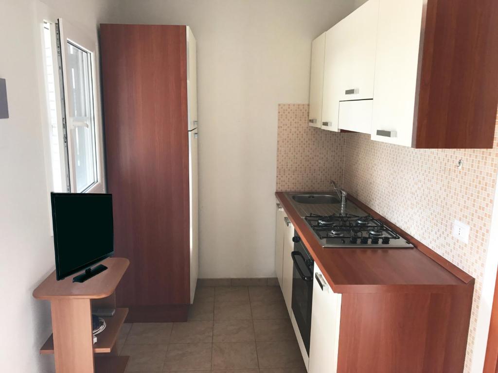 Kuchyň nebo kuchyňský kout v ubytování Camping Porto Miggiano