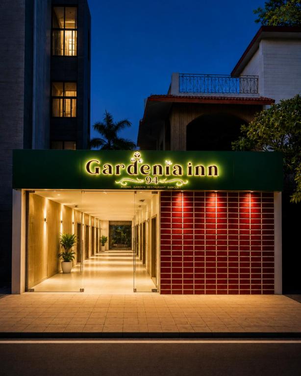 a building with a sign that readsarmaarma inn at night at Hotel gardenia inn in Gwalior