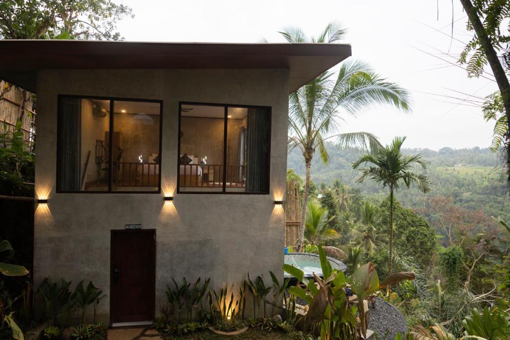 a house with a view of the jungle at The Beauty Riptide in Karangasem