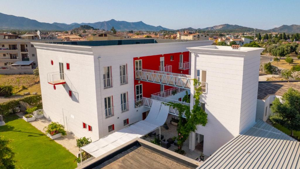 an aerial view of a white building with red accents at Glemerald Hostel in Pula