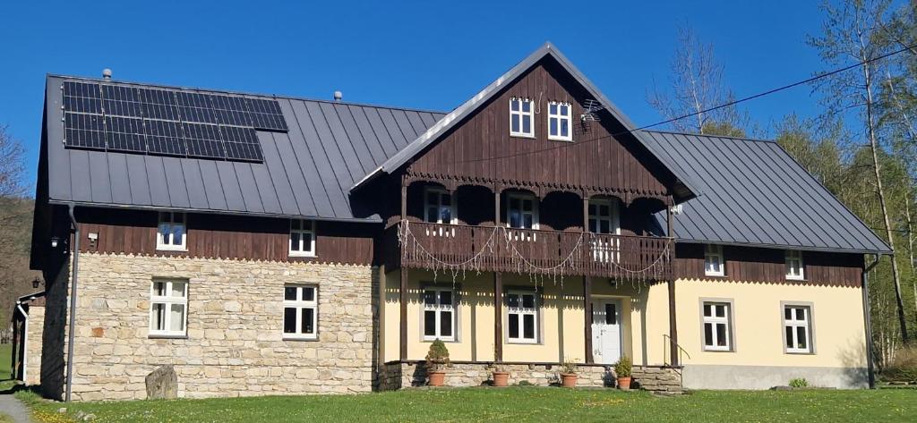 a large house with solar panels on top of it at Uspokój Ducha - Adults only in #N/A