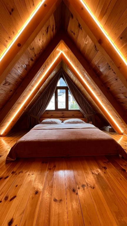 a bedroom with a bed in a attic at Underwoods_chill in Žabljak