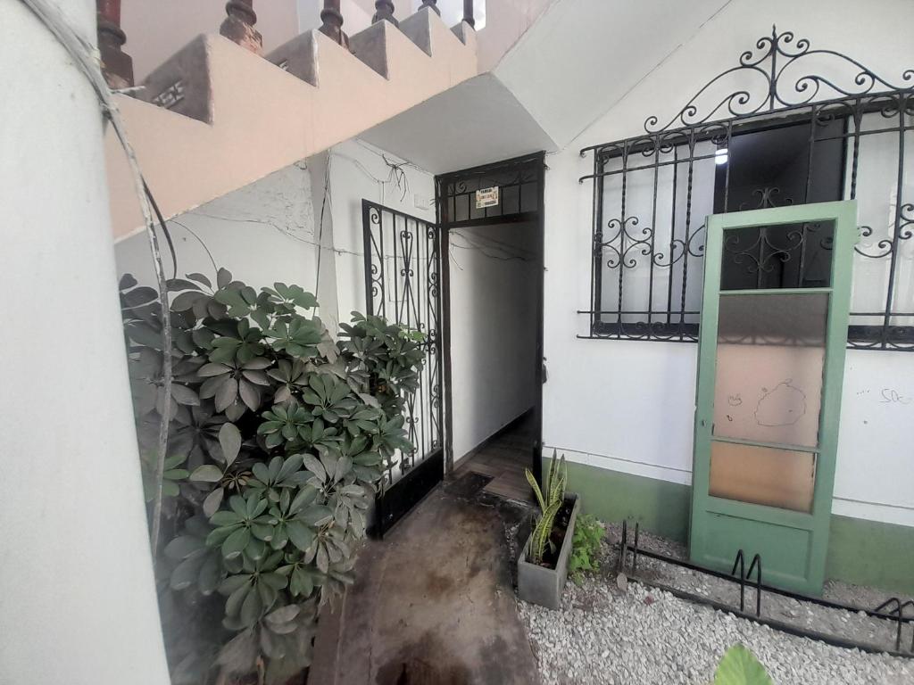 an entrance to a house with a door and plants at Hospedaje Maljut in Lima