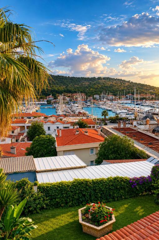a view of a harbor with boats in the water at Yalcin Hotel in Çeşme