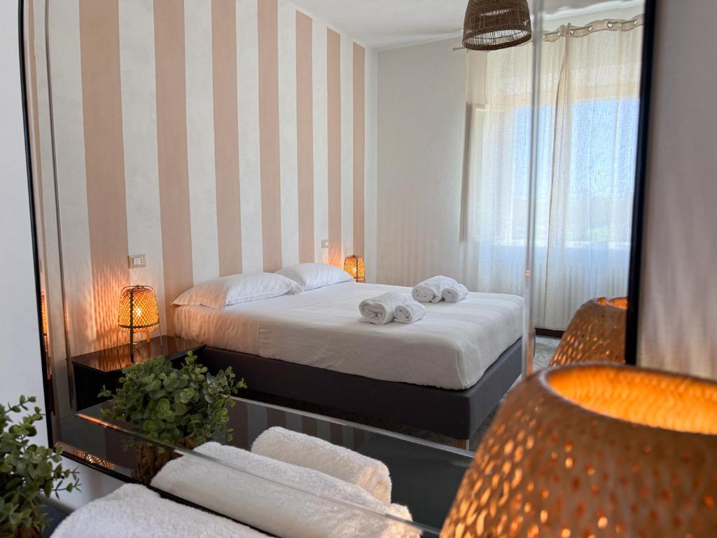 a hotel room with a bed and a mirror at Cuore di Nozzano Castello in Lucca