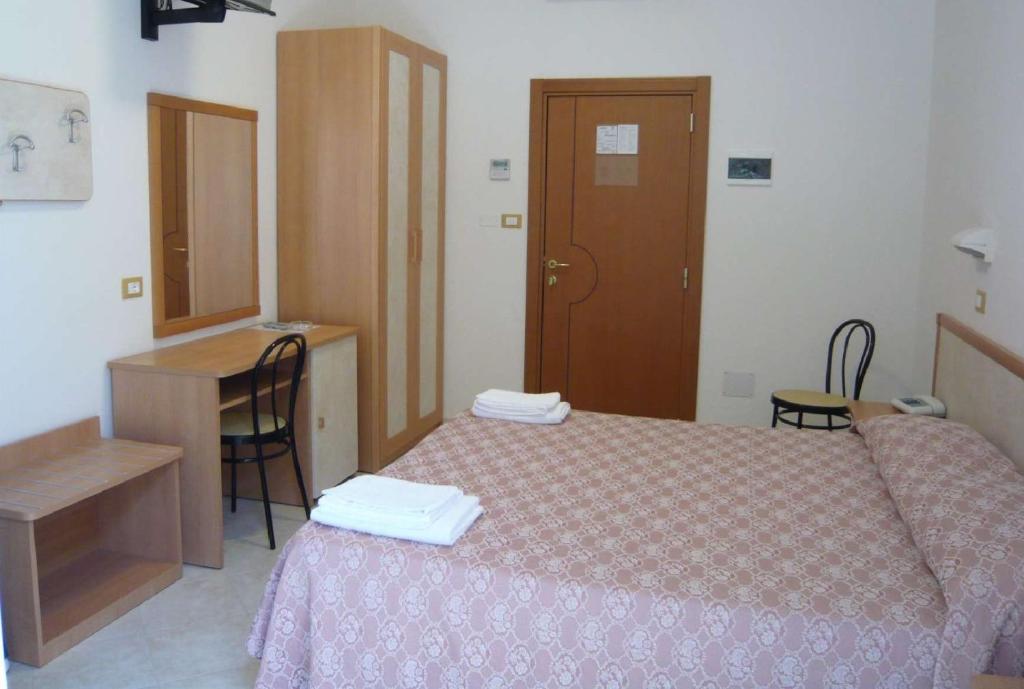 Postel nebo postele na pokoji v ubytování Hotel Calipso