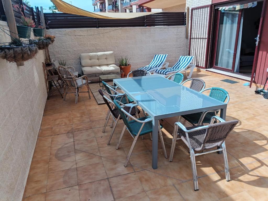 a blue table and chairs on a patio at Apartment with terrace in Vinarós
