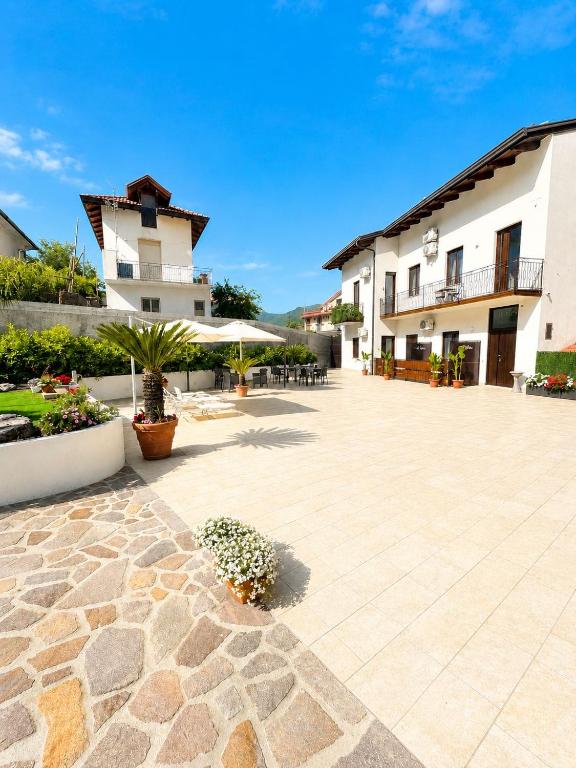 a courtyard of a hotel with a building at Carlo's Luxury Villa in Agerola