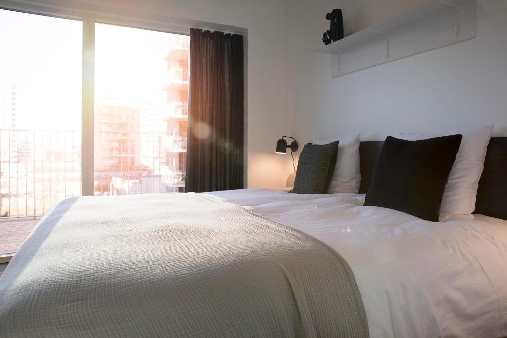 Postel nebo postele na pokoji v ubytování CPH Studio Hotel