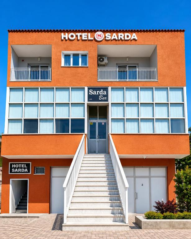 a hotel santa ana building with a staircase in front at HOTEL SARDA in Vau i Dejës