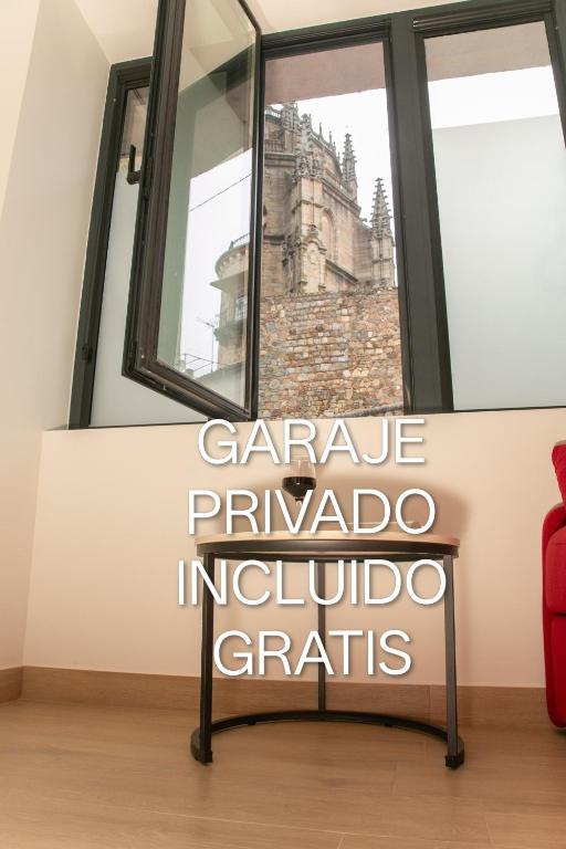 a window with a sign that reads geneva parado indivo grains at Apartamentos ÍCARO in Plasencia