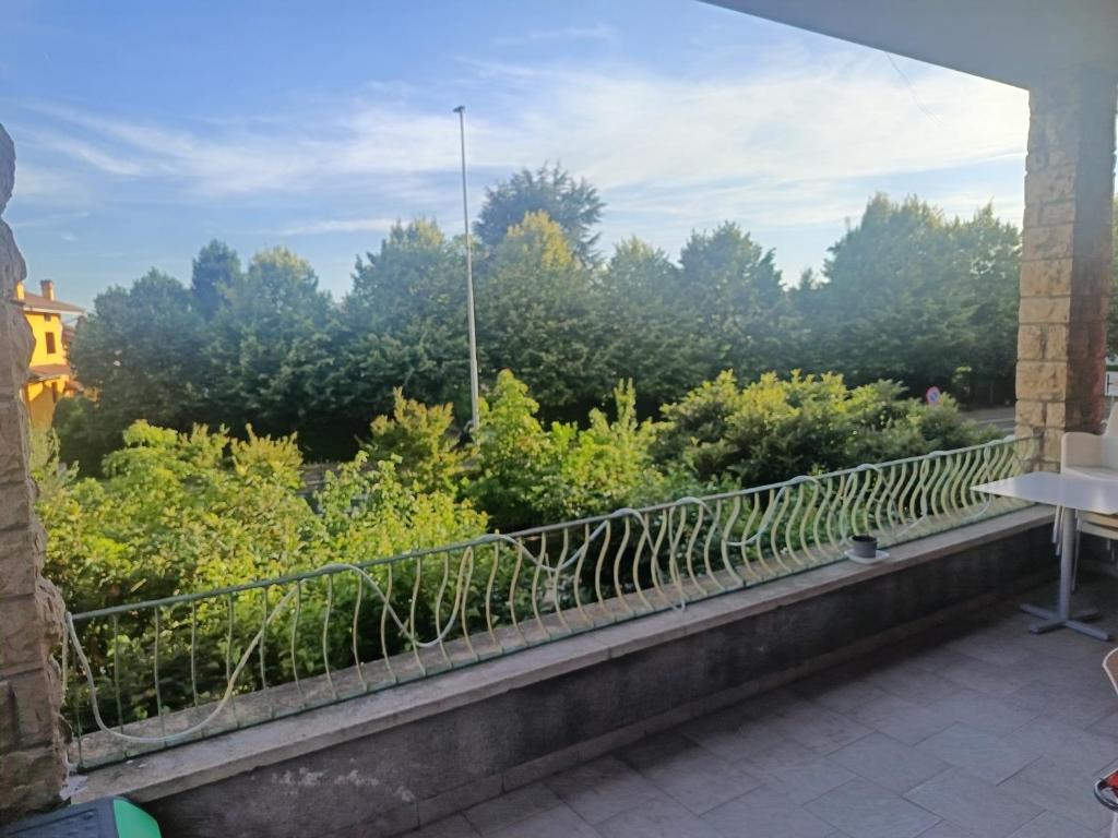 a balcony with a view of trees and bushes at B&B Villa AVE in Seriate