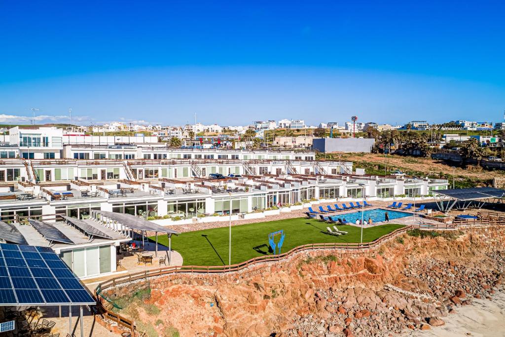 an aerial view of a building with a pool at Dog-friendly home 3 rows to beach with rooftop deck, pool, & kitchen in Rosarito