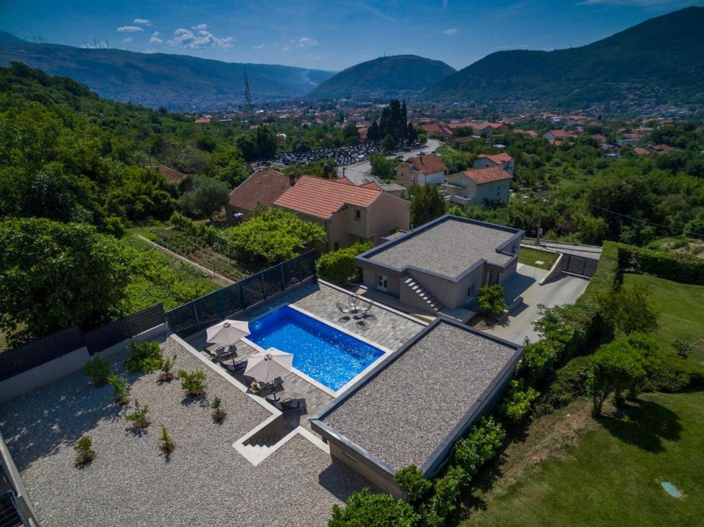 an aerial view of a house with a swimming pool at Villa La Lana in Mostar