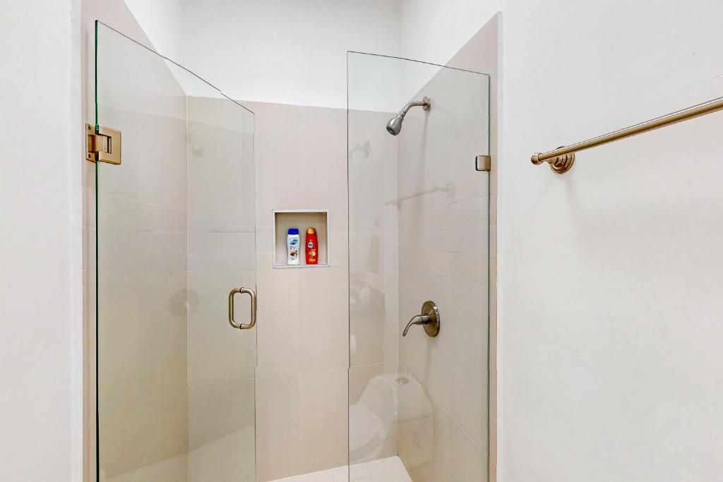 a shower with a glass door in a bathroom at Dog-Friendly Villa with Heated Outdoor Pool, Hot Tub, Streaming, Partial Views in Rosarito