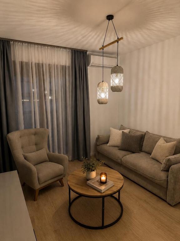 a living room with a couch and a table at Adriatic Escape in Radanovići