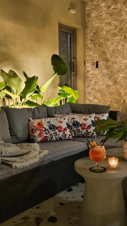 a living room with a couch and a table at SAmalia Apartments Nafplio in Nafplio