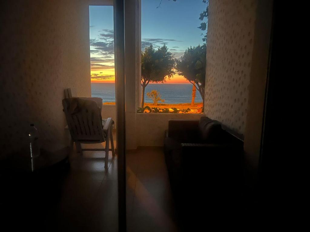 a room with a window with a view of the ocean at Marina Golf 7 in Asilah