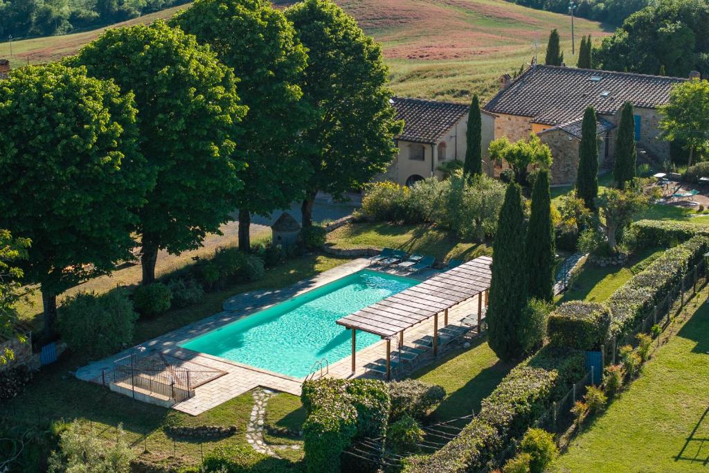 an overhead view of a swimming pool in a garden at Borgo Tignano in Casole dʼElsa