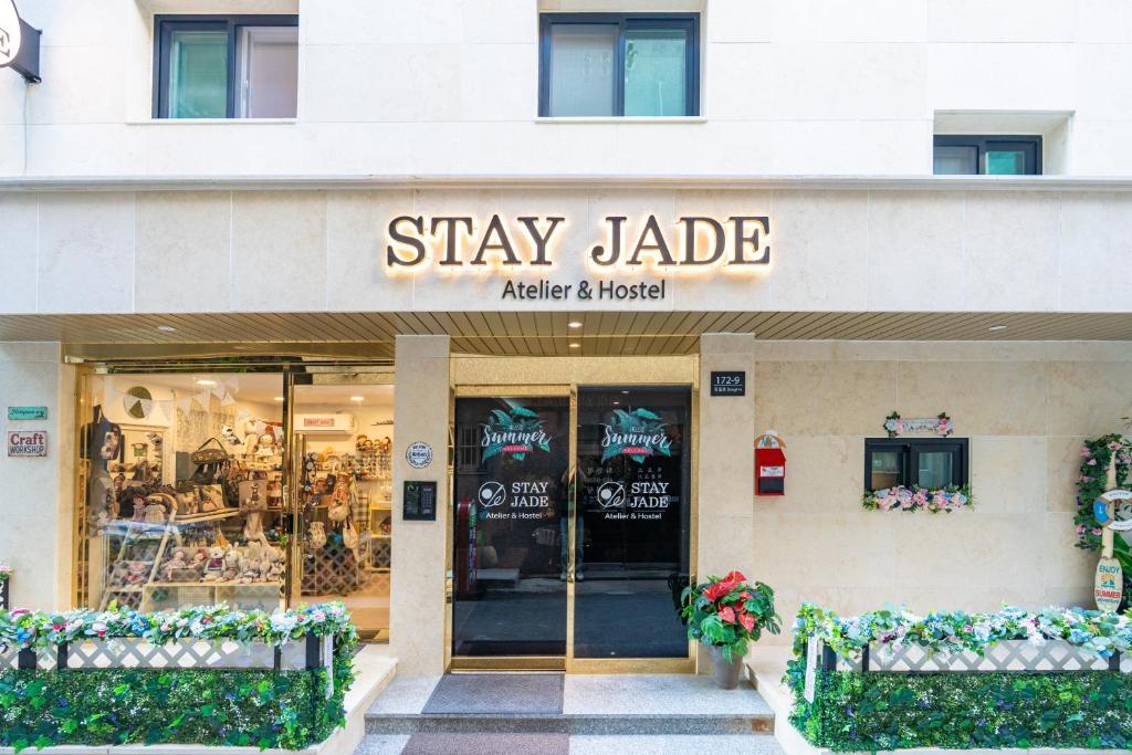 a store front with a sign that reads stay jade at Stay JADE in Seoul